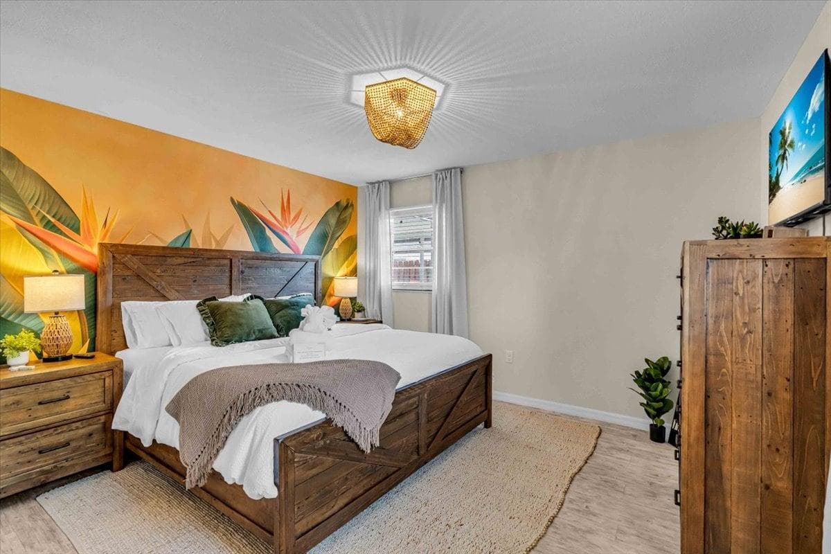 Master Bedroom: Vibrant tropical decor and plush furnishings create an inviting retreat for relaxation.
